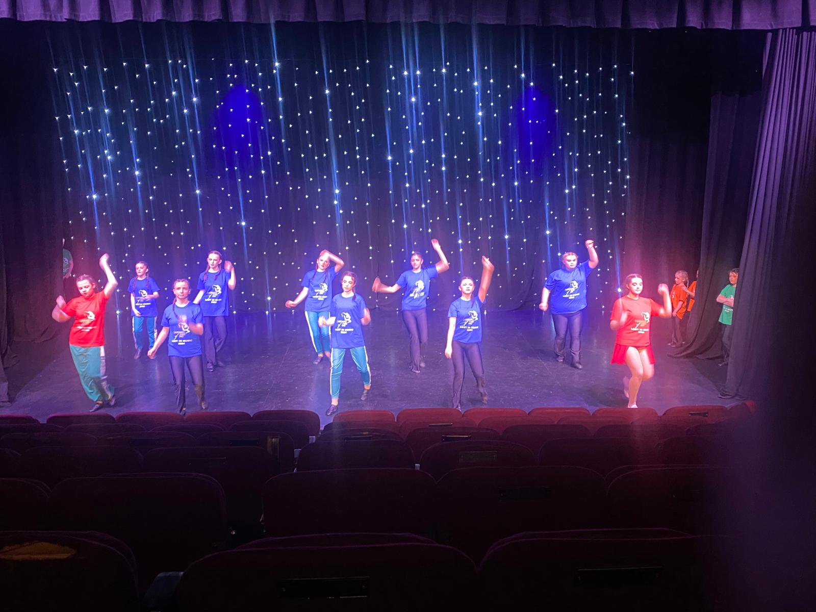 Modern dance group performing at Clairemarie’s School of Dance showcase